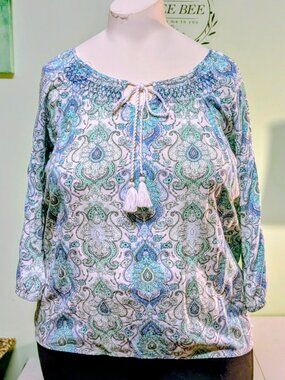 Adorable bohemian pullover blouse with 3 quarter length gathered sleeves.